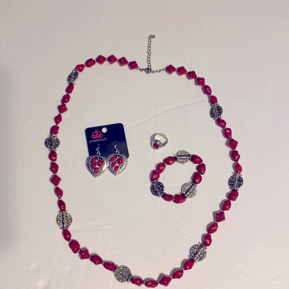 Ear rings are Paparazzi. Necklace, bracelet and ring are Premier Jewelry.